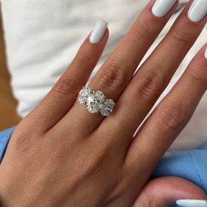 Three oval diamond three-stone engagement ring with a plain shank