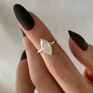Marquise solitaire engagement ring with six-prong setting and plain tapered band