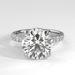Round engagement ring with hidden halo and pavé diamond band