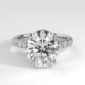 Oval hidden halo pavé diamond engagement ring with four-prong setting