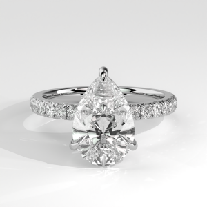 Pear shaped engagement ring with hidden halo and pavé band