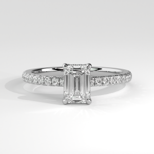 Emerald cut diamond engagement ring with pavé-set band in basket setting