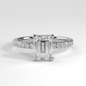 Emerald cut diamond pavé engagement ring with four-prong basket setting