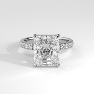 Radiant cut engagement ring with hidden halo and pavé-set band