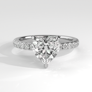 Heart-shaped diamond engagement ring with pavé shank and three-prong setting