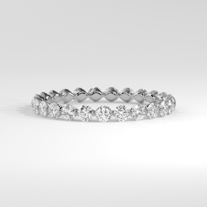 Full eternity diamond band with round stones in a shared prong setting