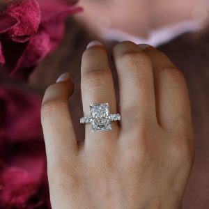 Radiant cut engagement ring with hidden halo and full round diamond eternity band