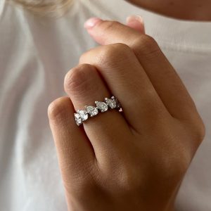 Eternity band with alternating pear-shaped diamonds in shared prong setting