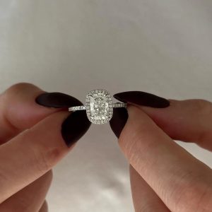 Elongated cushion halo pavé engagement ring with thin sparkling band