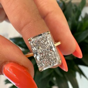 Radiant cut engagement ring with hidden halo and plain band