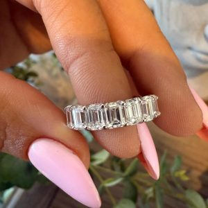 Emerald-cut diamond eternity band in shared prong setting, classic and modern style