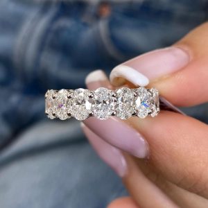 Elegant oval cut diamond eternity band with shared prong setting