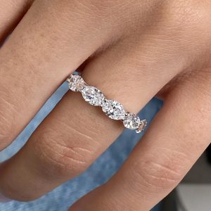 Five oval diamond ring with shared prong setting on polished band