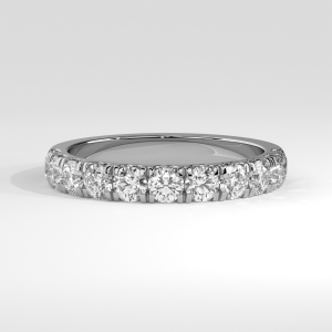 Partial eternity diamond band with shared-prong set round stones over a uniform band