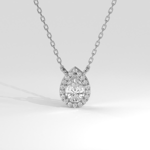 Pear-shaped diamond pendant with a halo suspended from a chain