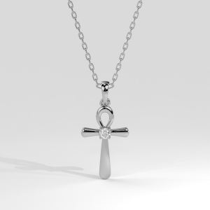 Ankh cross pendant with a round diamond center suspended from a chain